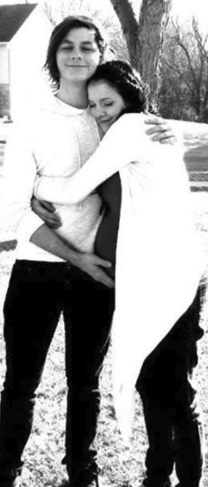 Young Cameron and Chelsey hugging, expecting Phoenix